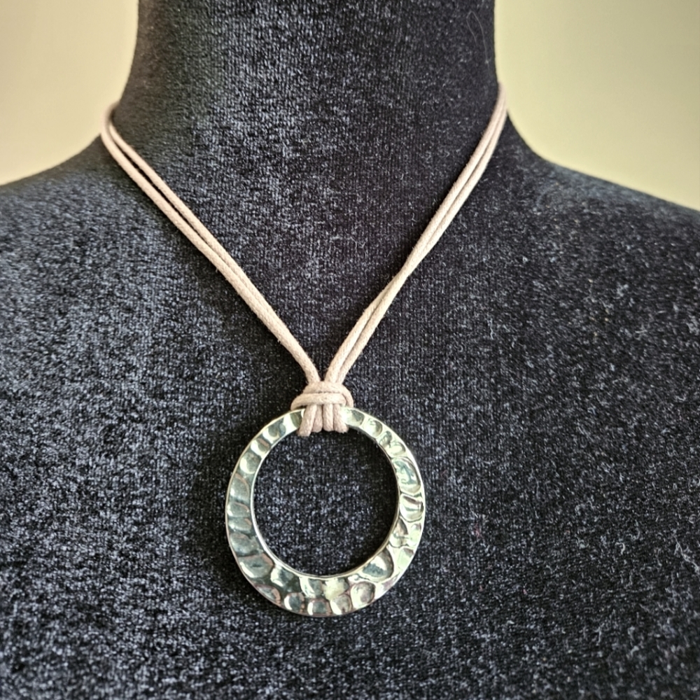 sterling silver hammered pendant on leather necklace